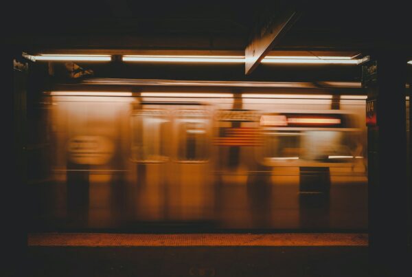 a blurry photo of a subway train at night